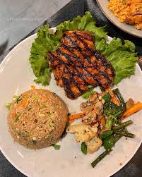 Grilled fillet steak with dating rice outside and mixed vegetable