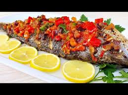 Full grilled fish with hot and spicy pepper sauce and salty vegetables